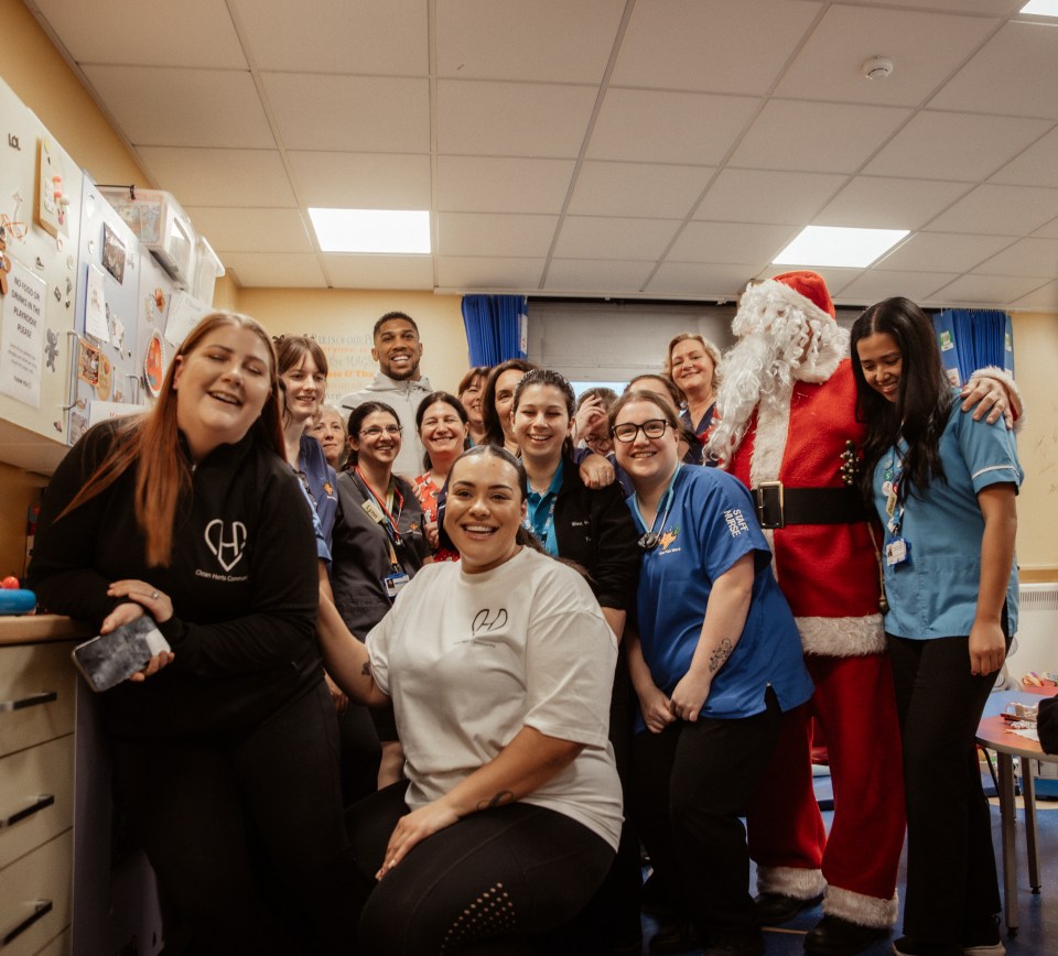 Anthony beams alongside NHS staff