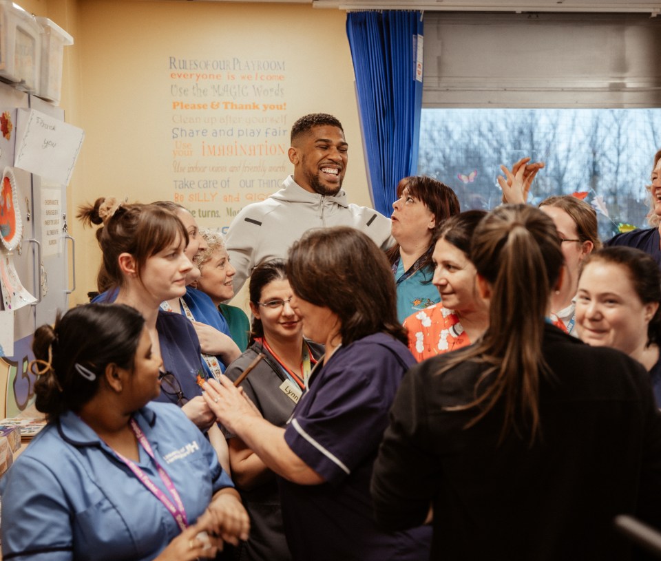 The boxer looked very happy speaking with NHS staff and parents