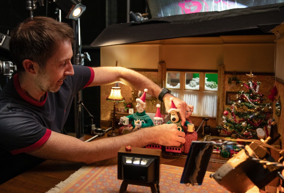 An animator getting the characters in position for one of the Christmas special scenes