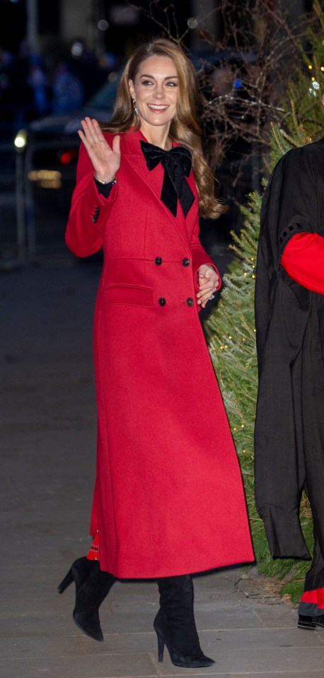 Kate Middleton re-wearing a Christmassy red double-breasted coat by Alexander McQueen