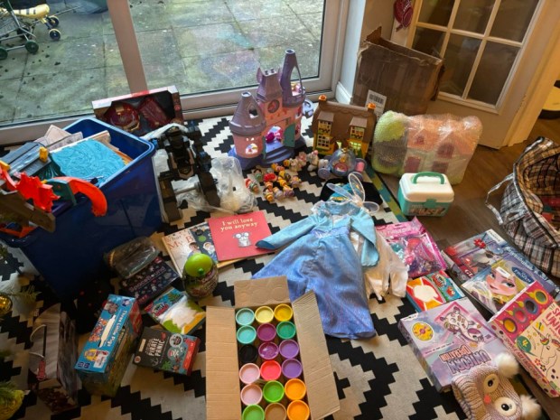 Large pile of children's Christmas presents.