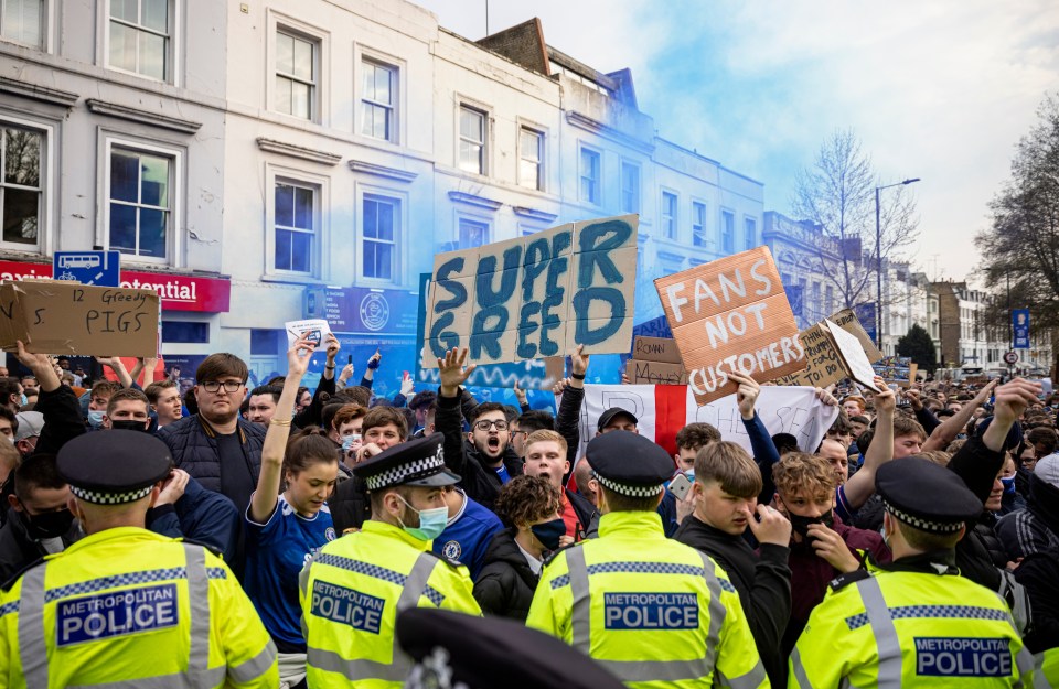 Footie fans slammed a plot to revive the hated European Super League, above protesters outside Stamford Bridge in  2021