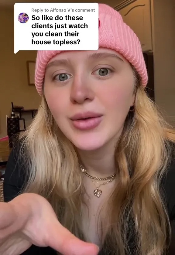 Woman responds to a comment asking if wealthy clients watch her clean their houses topless.