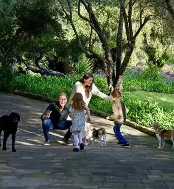 Prince Harry and Meghan's holiday card featuring photos of their family and charitable work.