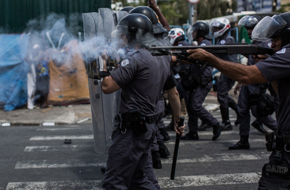 Police officers in Sao Paulo, Brazil, confronting suspected drug users.