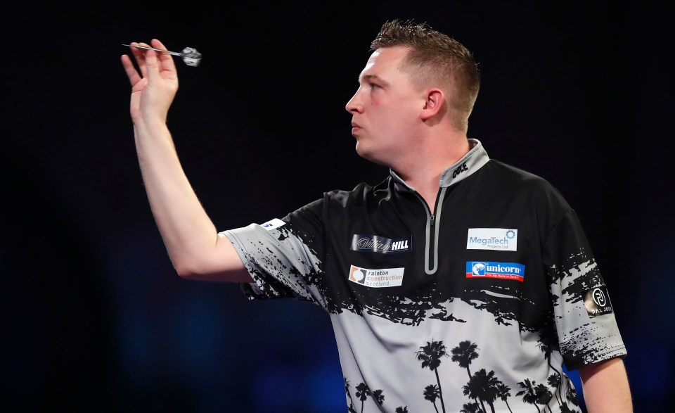 Chris Dobey of England playing darts.