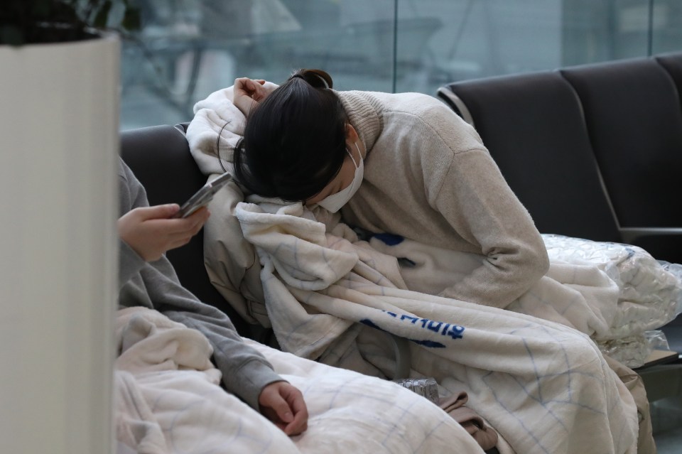 A grieving relative at Muan International Airport.