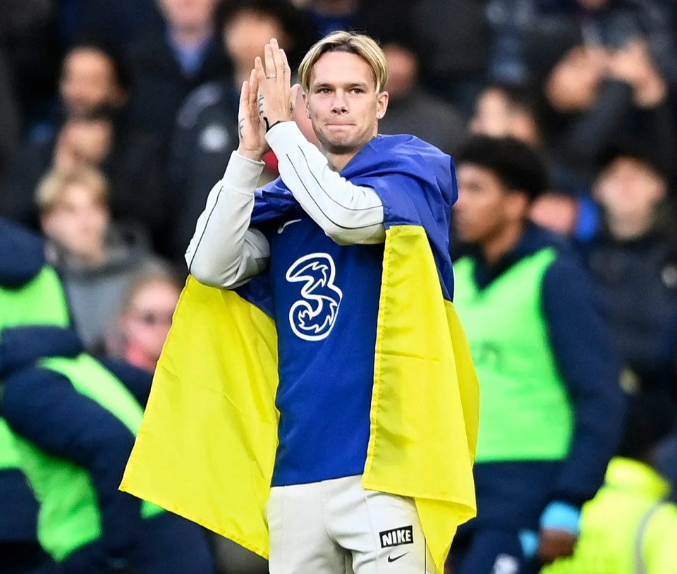 Mykhailo Mudryk applauds Chelsea fans.