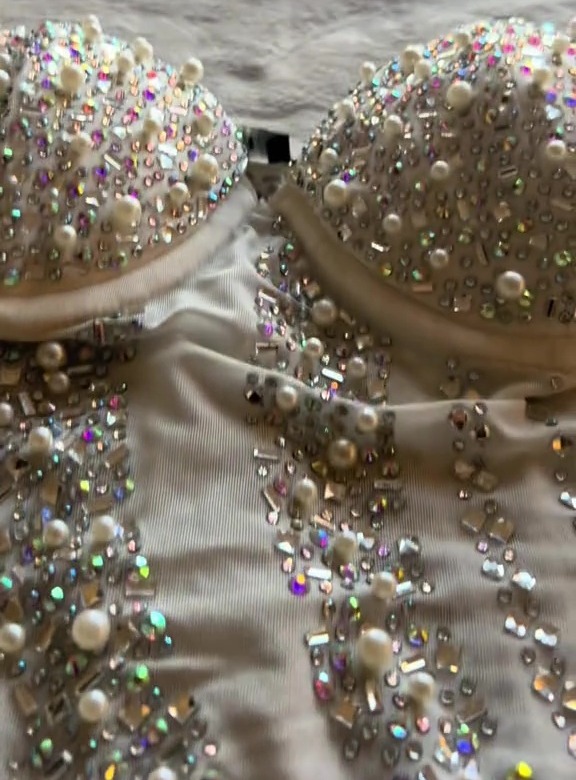 Close-up of a beaded wedding dress bodice.