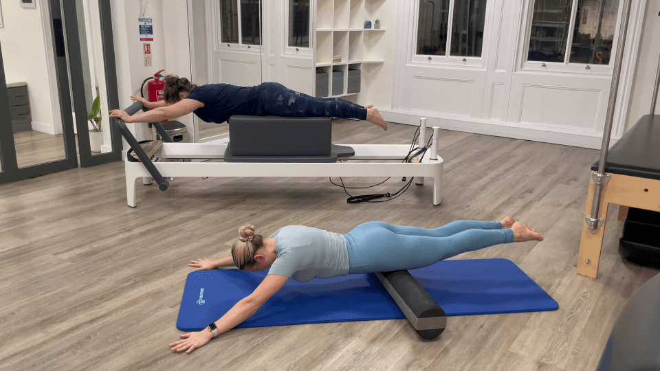 The swan move uses a foam roller if you're not on the reformer bed