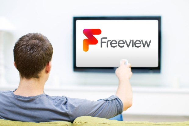 Man watching Freeview on TV.