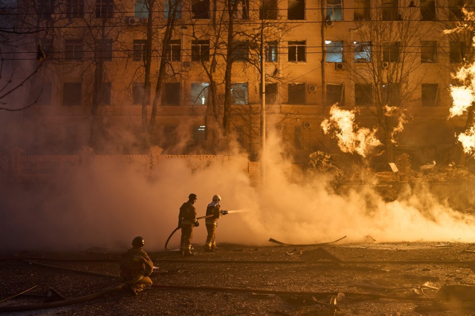 Firefighters look to put out a blaze in Ukraine following a missile blast