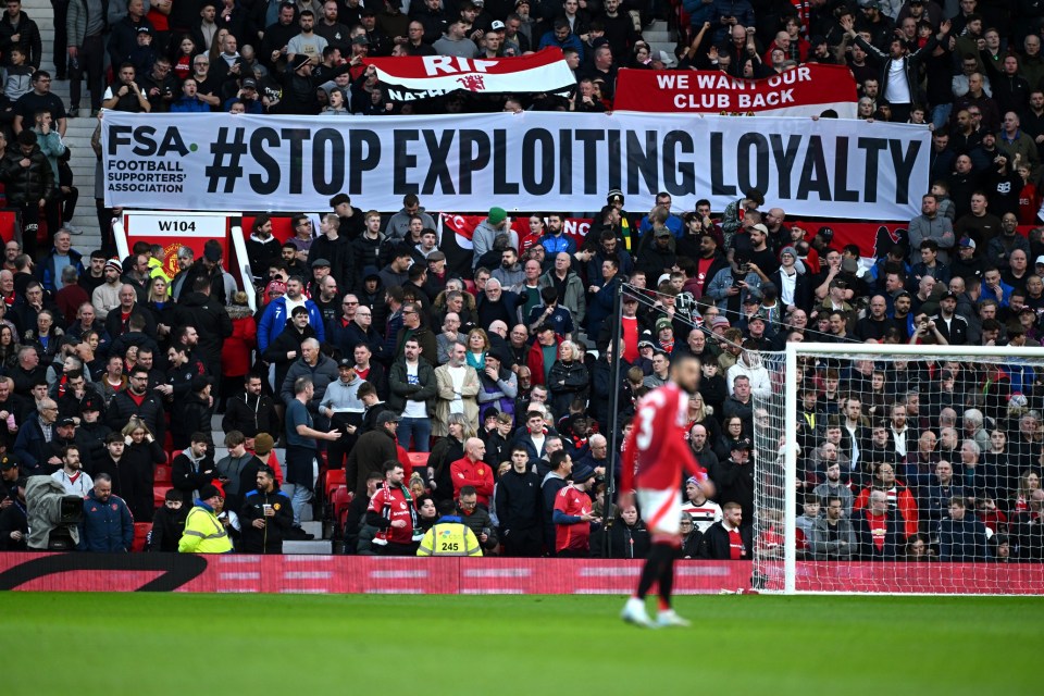 MANCHESTER, ENGLAND - DECEMBER 01: Fans of Manchester United are seen with a #Stop Exploiting Loyalty banner in protest against ticket prices during the Premier League match between Manchester United FC and Everton FC at Old Trafford on December 01, 2024 in Manchester, England. (Photo by Gareth Copley/Getty Images)