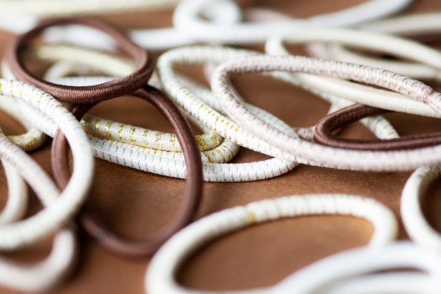 Close-up of brown and white hair elastics.