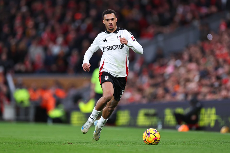 Antonee Robinson of Fulham FC dribbling the ball during a Premier League match.