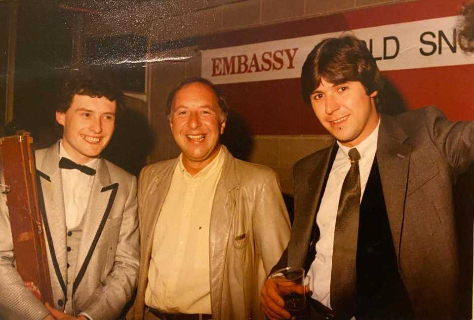 Three men at an Embassy event.