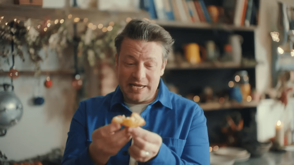 Jamie Oliver inspecting a cooked potato.