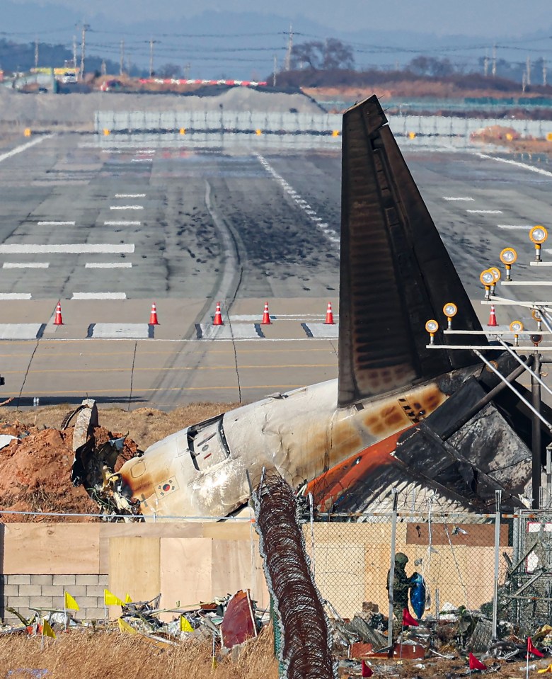 The wrecked tail section of the Jeju Air Boeing 737-800 aircraft