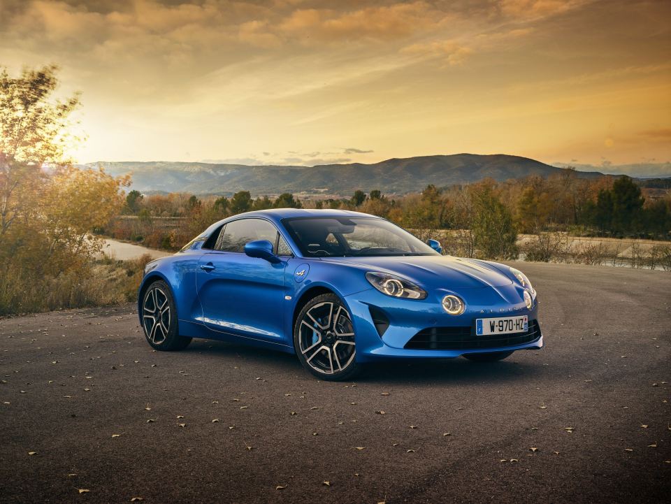 Blue Renault Alpine A110 parked outdoors.