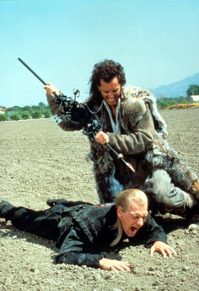 Scene from Warlock (1988) showing Richard E. Grant attacking Julian Sands.