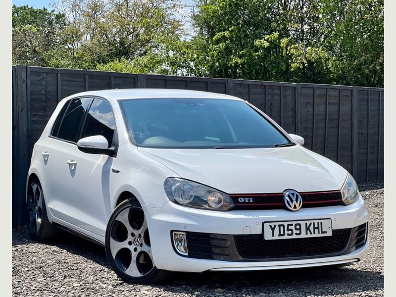 White Volkswagen Golf GTI.