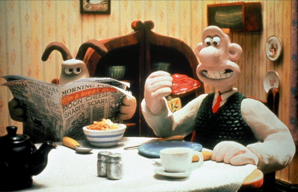 Wallace and Gromit eating breakfast.