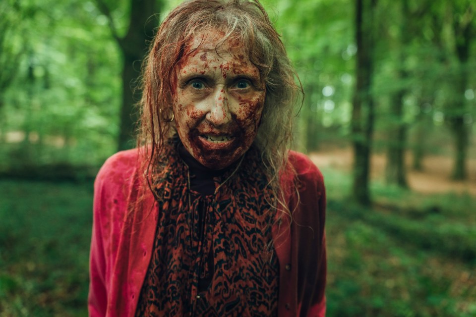 Bloody woman in a forest.