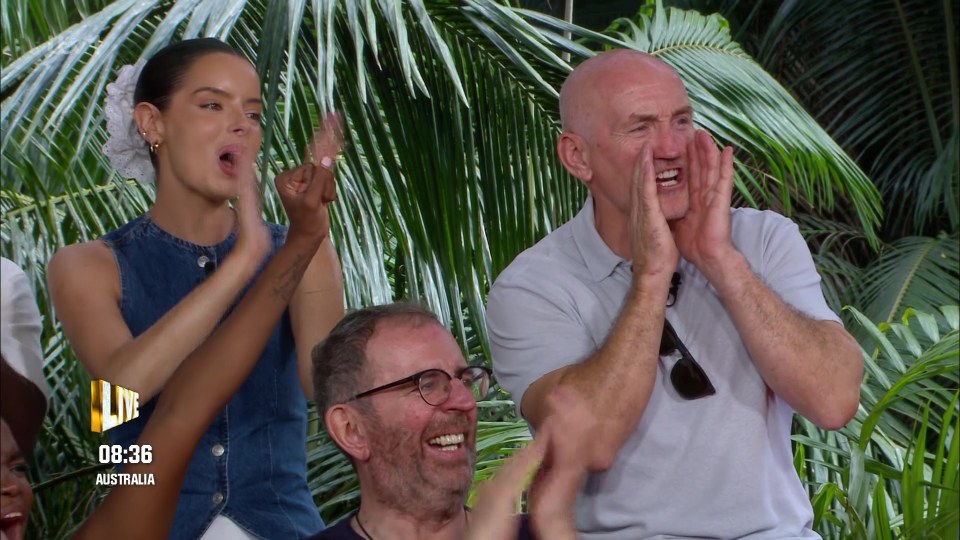 Fellow I'm A Celeb stars Maura Higgins, Richard Coles and Barry McGuigan cheer Danny on from the sidelines after his win