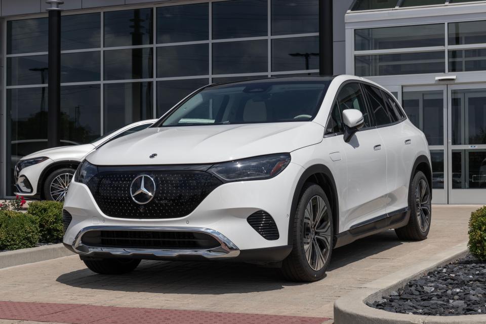 White Mercedes Benz EQE 350 4MATIC SUV at dealership.