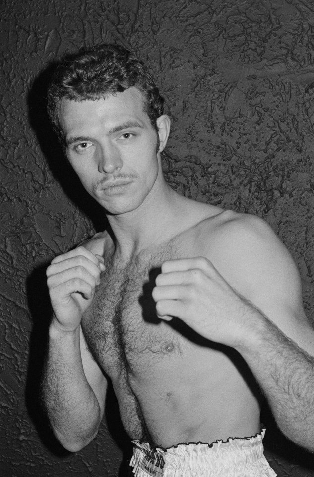 Black and white photo of Neil Malpass, a British heavyweight boxer.