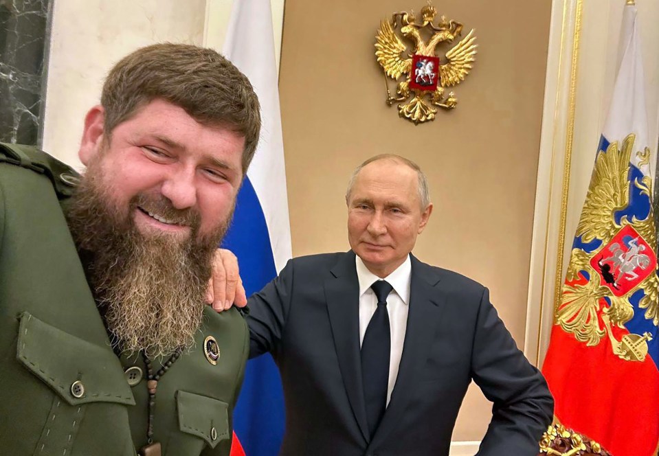 A puffy faced Kadyrov smiling with his boss Vladimir Putin