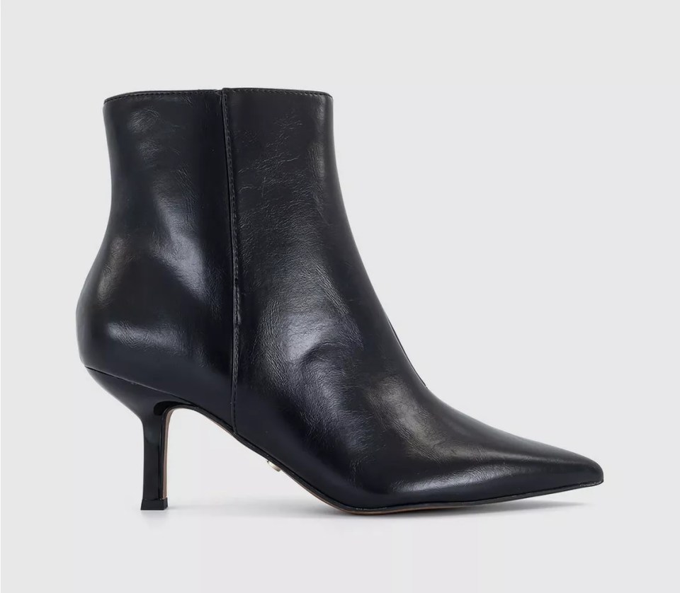 Black leather ankle boots with stiletto heels.