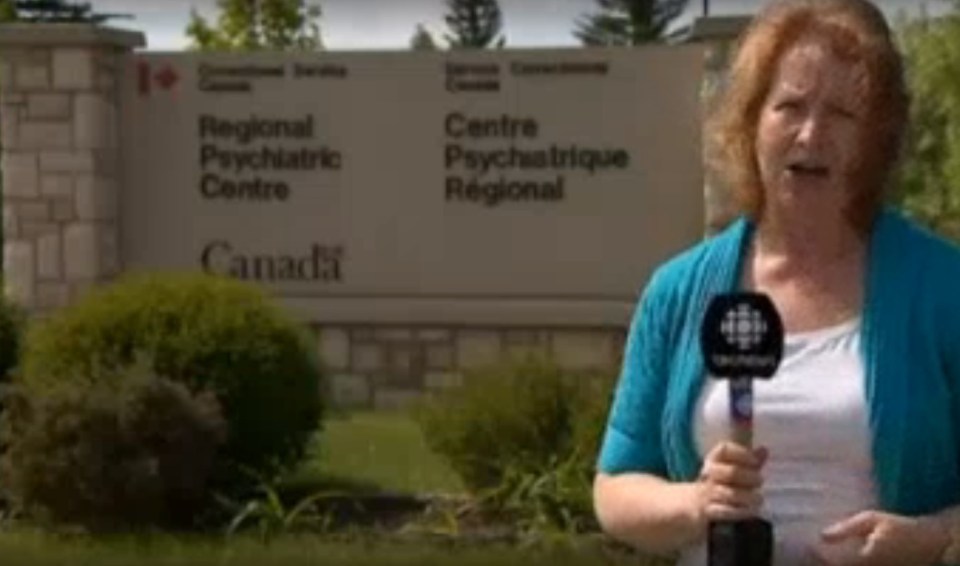 Reporter standing outside the Regional Psychiatric Centre in Canada.