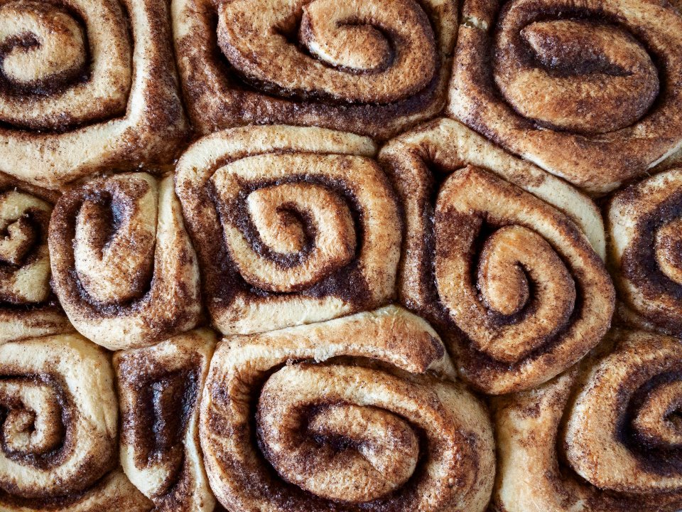 Overhead view of baked cinnamon rolls.