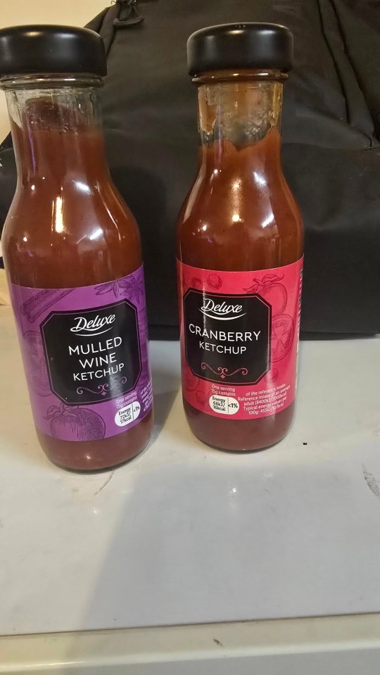 Two bottles of Deluxe ketchup: mulled wine and cranberry.