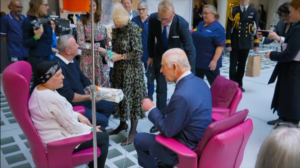 King Charles speaking with a cancer patient.