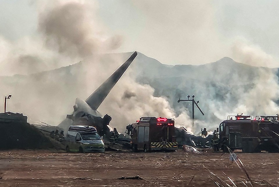 Firefighters carry out extinguishing operations on an aircraft which drove off runway at Muan International Airport in Muan, South Jeolla Province, South Korea, December 29, 2024. Yonhap via REUTERS THIS IMAGE HAS BEEN SUPPLIED BY A THIRD PARTY. NO RESALES. NO ARCHIVES. SOUTH KOREA OUT. NO COMMERCIAL OR EDITORIAL SALES IN SOUTH KOREA.