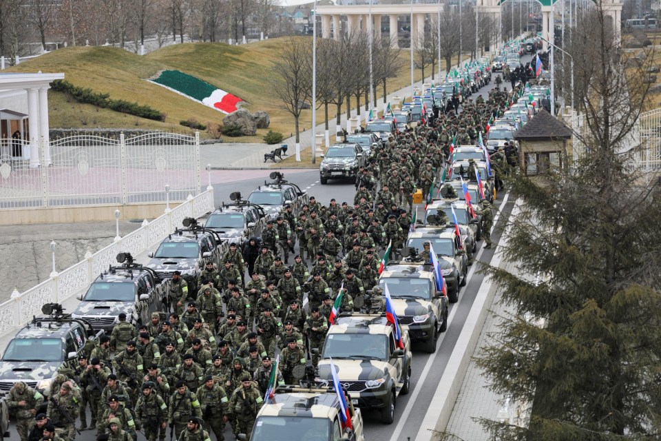 Chechen service members march along a street following one of Kadyrov's speeches on the Ukraine war