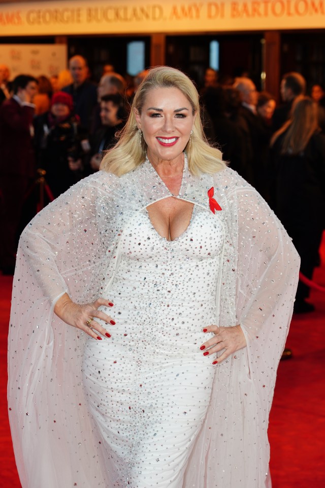 Claire Sweeney sparkled in a white dress and matching sheer cape