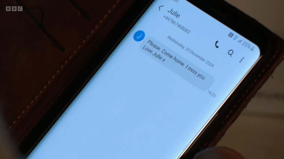 Phone displaying a text message from Julie asking the recipient to come home.