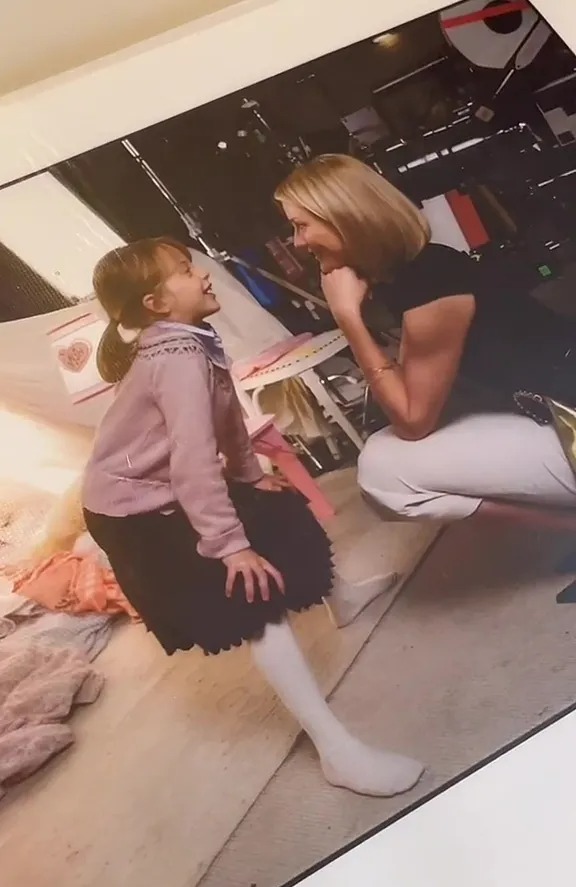 Behind-the-scenes photo of a young girl and a woman on the set of *The Holiday*.