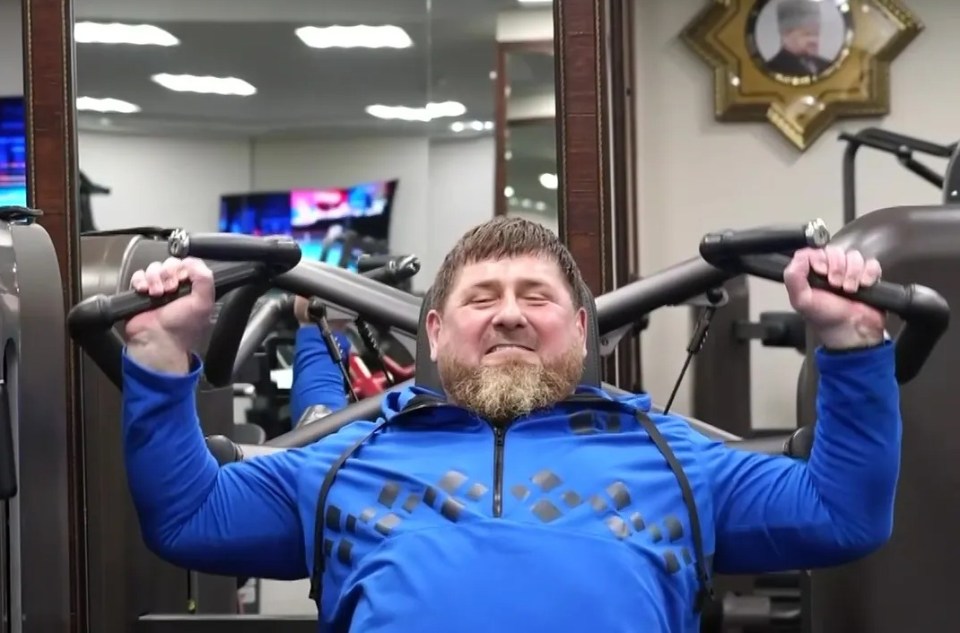 Kadyrov lifting weights in the gym as he tries to keep up his tough guy act