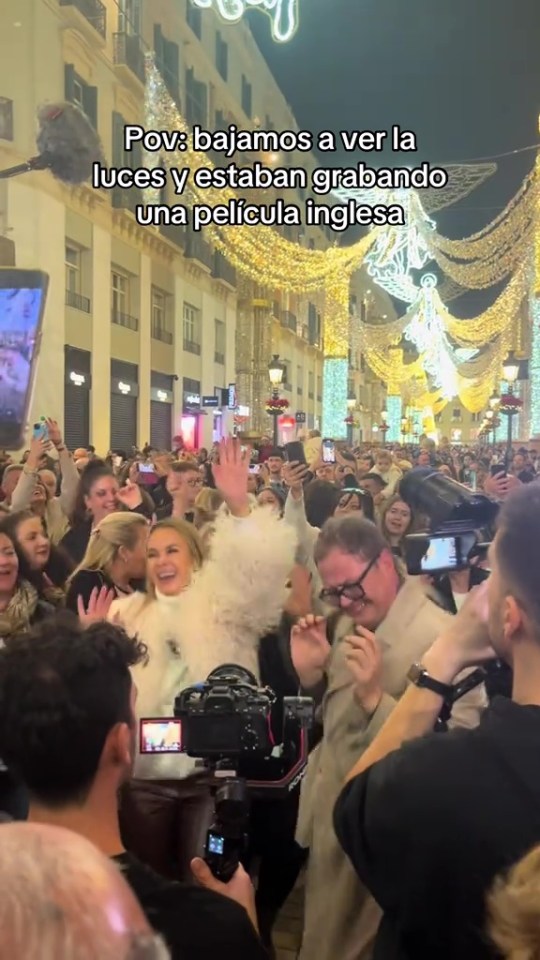 Alan Carr and Amanda Holden have been spotted dancing with revellers at a Xmas light switch-on in Spain