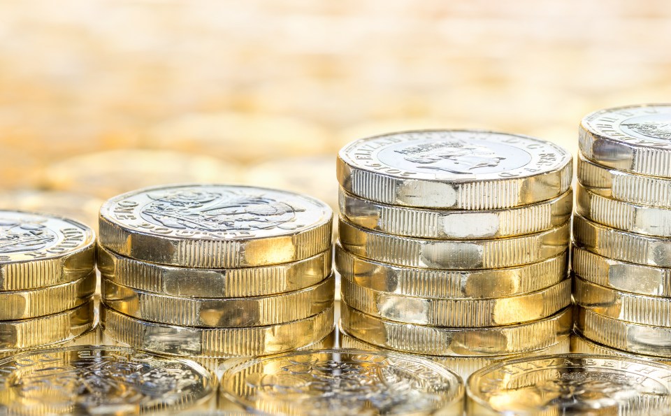 Ascending stacks of British one-pound coins.