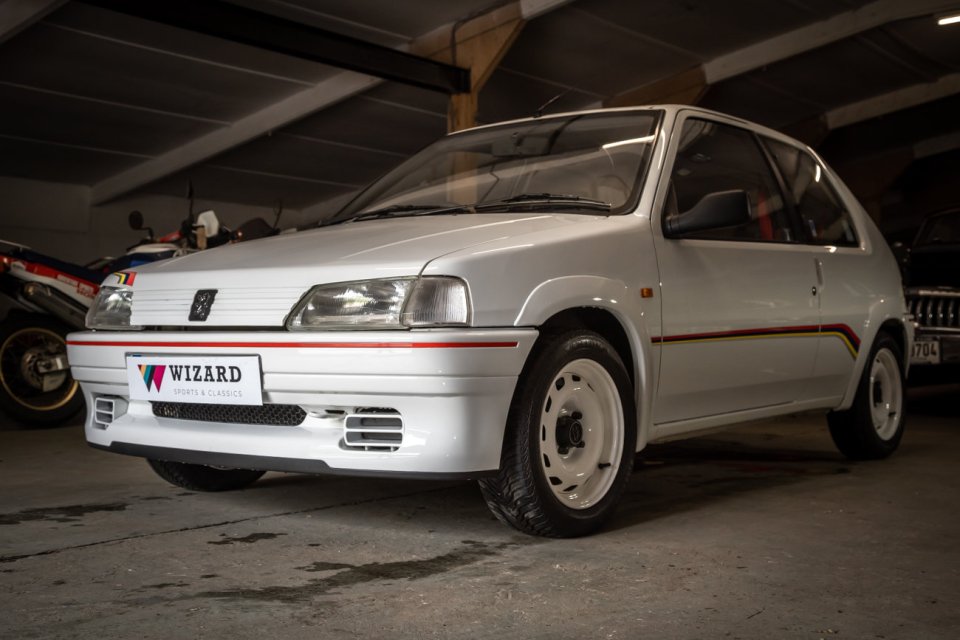 White Peugeot 106 rally car.