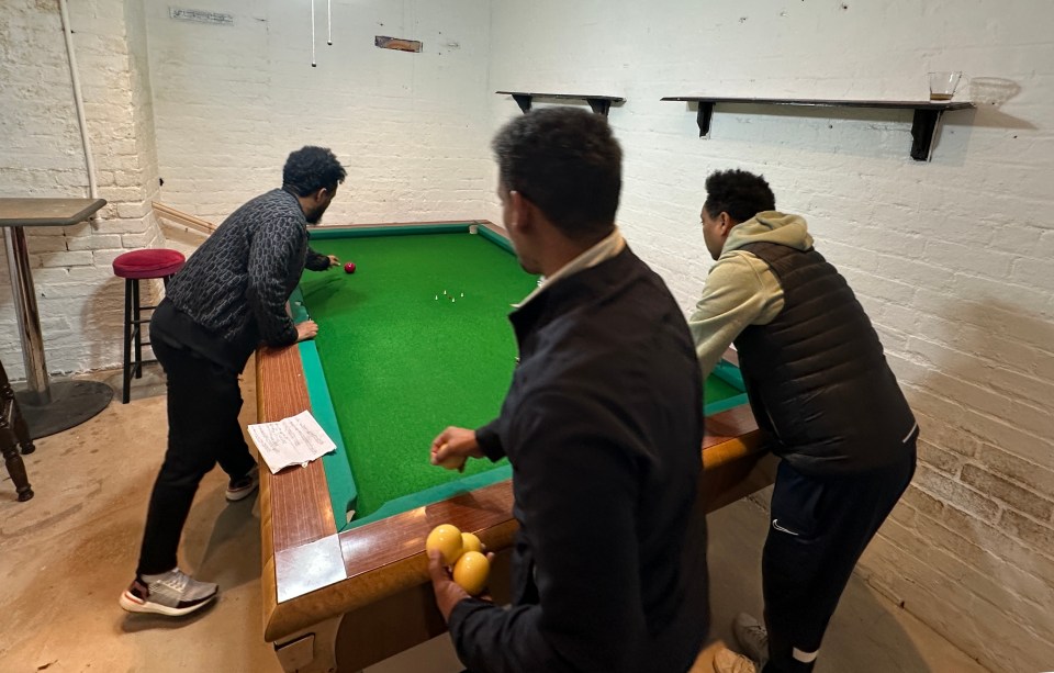 Abraham, Bini and Musgun are playing an Italian game called Vilado on a pool table