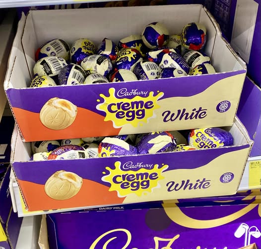 Two boxes of Cadbury Creme Egg White chocolate eggs.