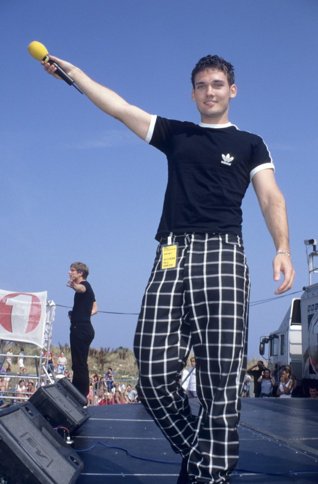 Lee Murray holding a microphone at a BBC Radio 1 Roadshow.