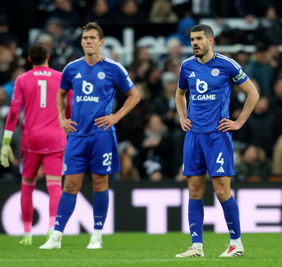 Jannik Vestergaard and Conor Coady of Leicester City look dejected during a soccer match.