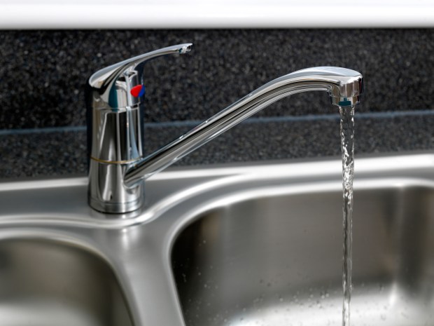 Water running from a kitchen tap.